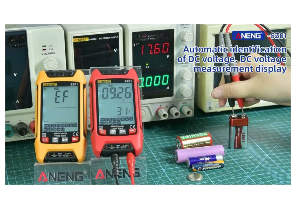 Electrician using a portable multimeter to troubleshoot a car battery.